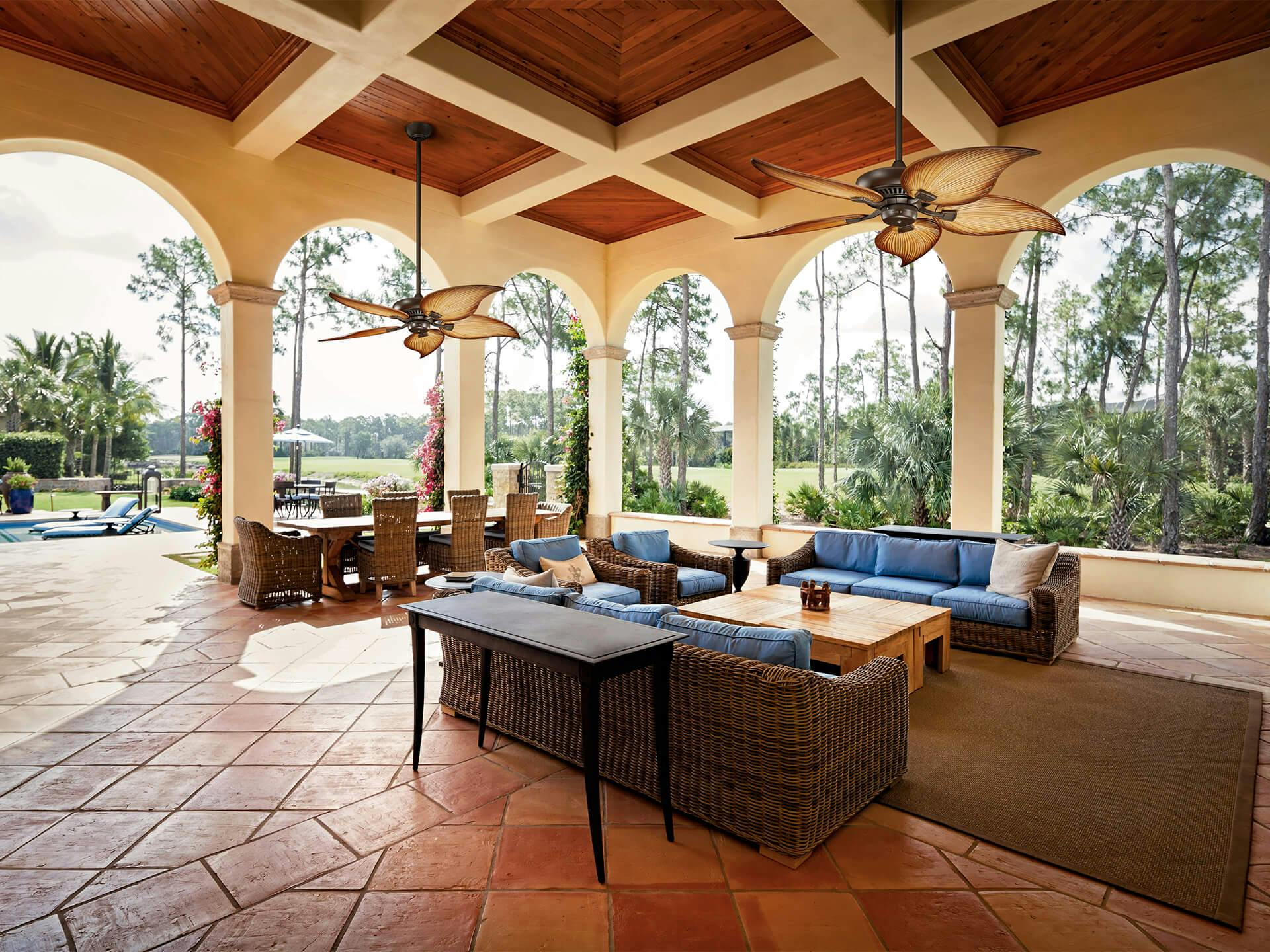 2 Canfield Outdoor Ceiling Fans hung over a covered outdoor patio area